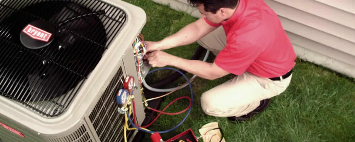 HVAC technician servicing an outdoor air conditioner unit in Las Vegas, NV